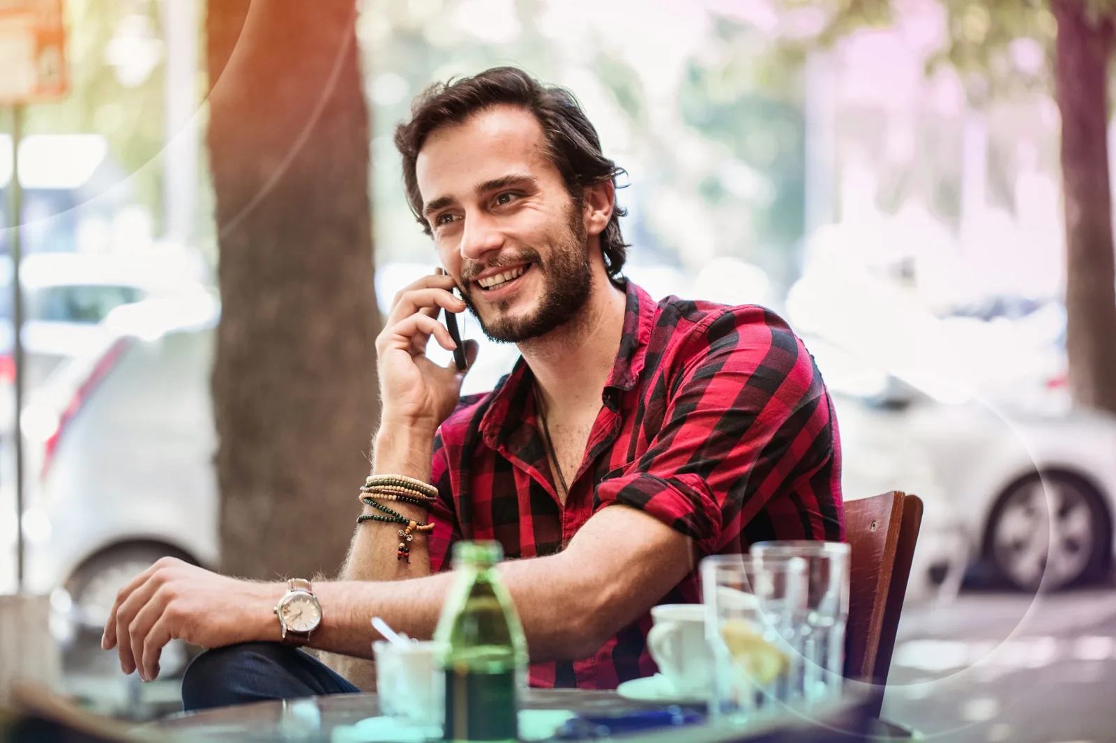 Young man calling from a cafe