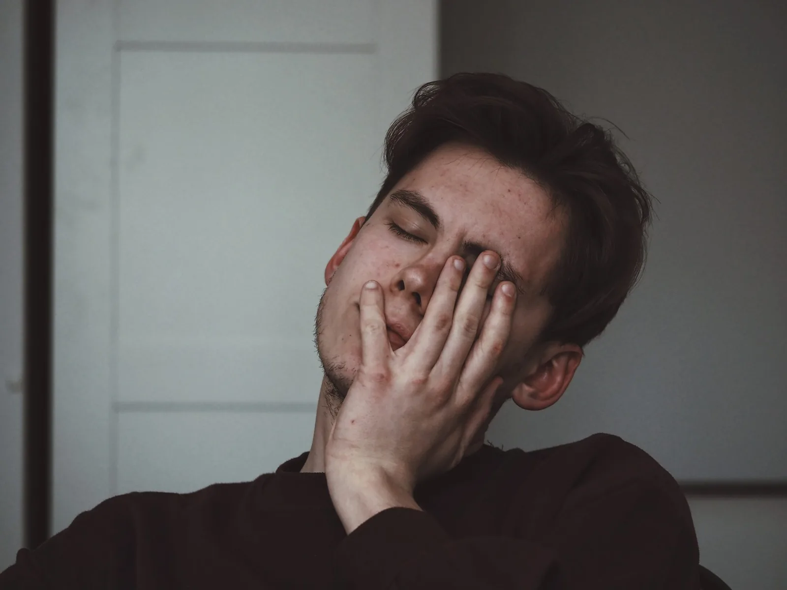 Man rubbing tired eyes