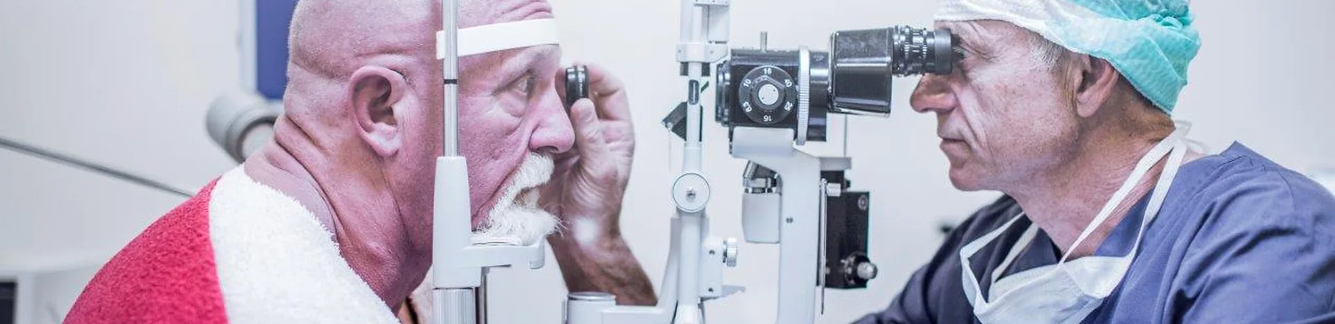 A patient having their eyes examined at the slit lamp